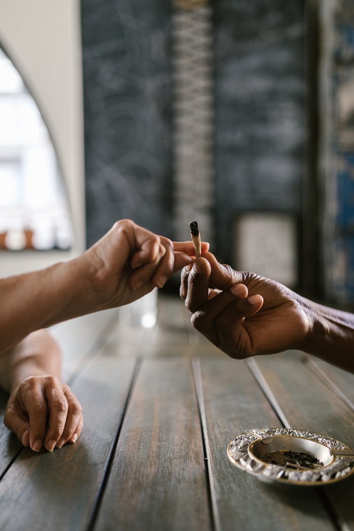 Person Holding a Joint